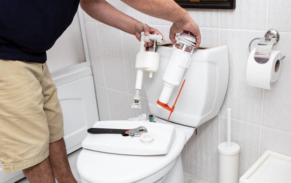 bathroom toilet being repaired