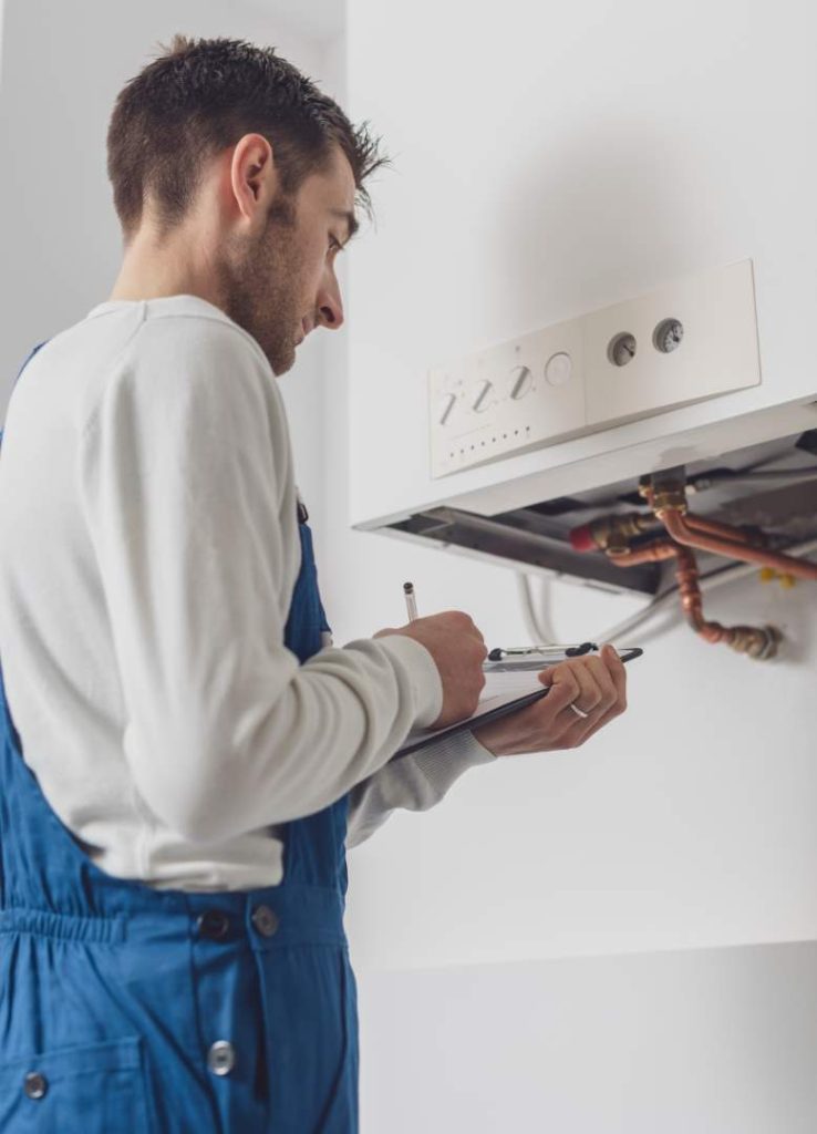 engineer testing gas boiler